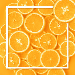 Top view of orange fruit pattern with frame template background.flat lay