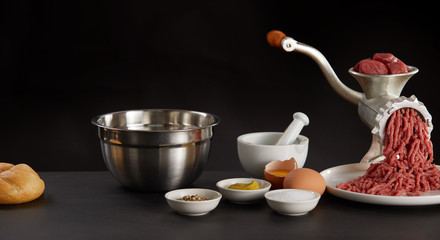 Meat minced in grinder and other ingredients