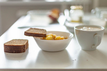 potatoes with meat, Chuvash dairy product and three pieces of Borodino bread on a white table