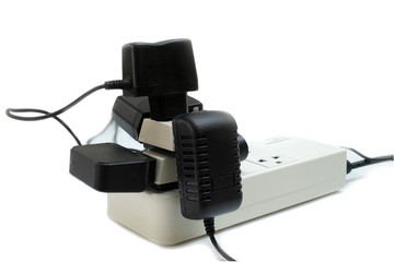 Multiple socket with connected power Strip with a bunch of plugs and adapter on white background