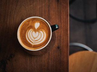 coffee latte on the wood desk in cafe