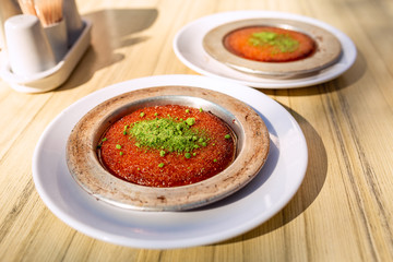 Turkish traditional dessert kunefe with cheese, served hot