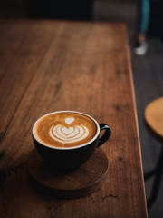 coffee latte on the wood desk in cafe