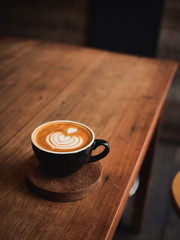 coffee latte on the wood desk in cafe