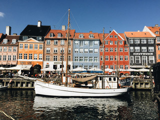 Row of traditional, colorful Danish buildings along the canal in Nyhavn.  Copenhagen, Denmark