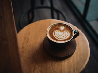 coffee latte on the wood desk in cafe