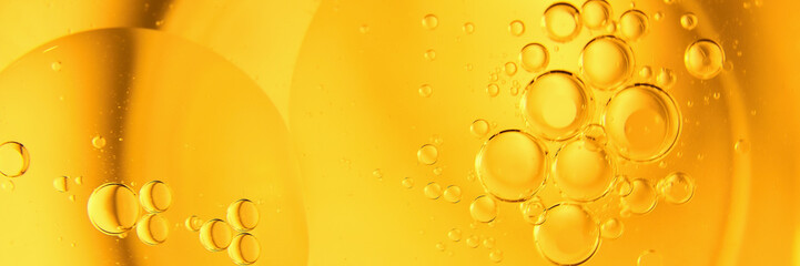 Yellow bubbles and drops of oil background, kitchen pattern, orange beverage background.