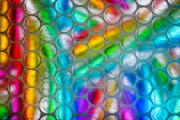 Abstract textured background of a colorful sheet of plastic bubble wrap