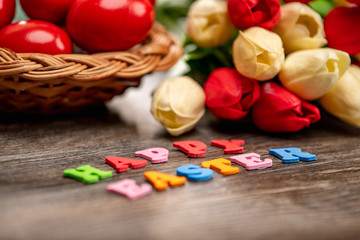 Beautiful tulips on wooden background