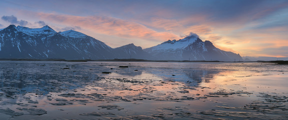 Majestic Icelandic Bat Mountain vestrahorn sunrise water reflection. Most popular place in golden circle in Iceland. 