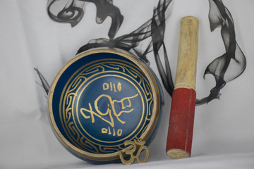Hand Crafted bronze Singing Bowl painted in Blue and Gold color, often used for meditation