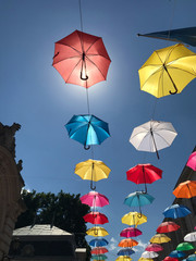 Colored umbrellas against the sky