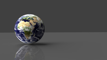 Planet Earth placed on grey glossy desk with reflection. 3D render. Elements of this image furnished by NASA - obrazy, fototapety, plakaty