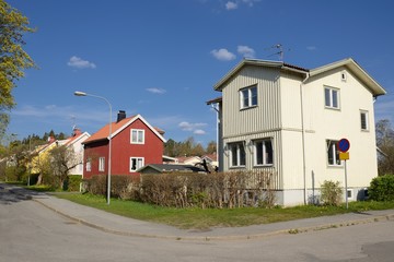 Fototapeta na wymiar Scandinavian housing, summer day with blue sky
