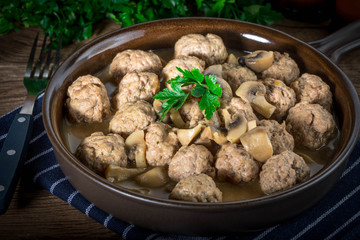 Delicious homemade swedish meatballs with mushroom cream sauce. Small depth of field.