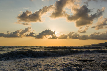 Amazing sea sunset, the sun, waves, clouds