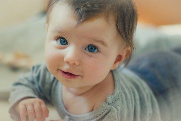 happy baby toddler with blue eyes portrait