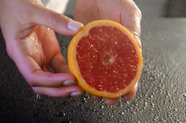 grapefruit in the hands