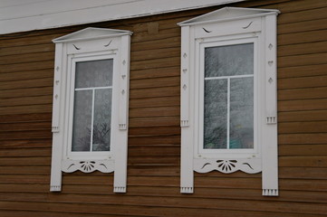 Obraz na płótnie Canvas white wooden carved frames by the window