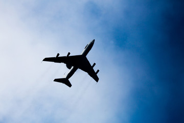 Luxury private jetliner flying above clouds.