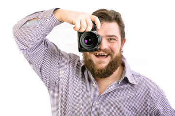 portrait of big handsome bearded photographer taking photo with professional DSLR camera, isolated on white