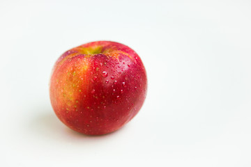 Red apple on the white ground
