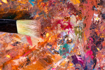 Closeup Beautiful colorful Abstract painting On palette with acrylic and brush strokes
