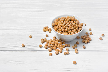Uncooked chickpeas in white bowl