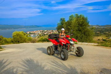 Girl riding quad on the island © Vladislav Gajic
