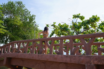 Woman standing on a bridge in Siquijor Island, Philippines