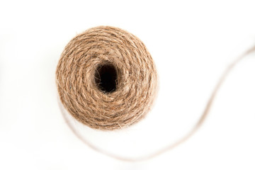 Jute cord on the white ground, close up, flat lay