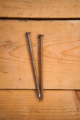 Rusty nails on the wood ground