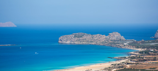 View on Falasarna beach, Crete Island landmark. Paradise beach with turquoise water and pink sand, Greece