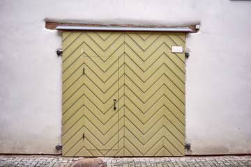 Old green wooden door on wall - Powered by Adobe