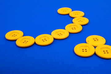 yellow buttons in semicircle on blue background