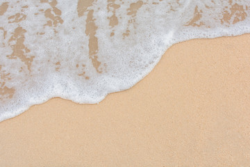 Soft wave of sea on empty sandy beach Background with copy space