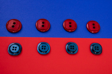 blue buttons on red background and red buttons on blue background separated in the middle