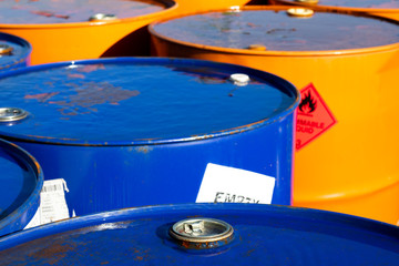 Top of 200 litre 55 US gallon empty gasoline drums in storage area awaiting pick up