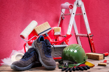 Professional house painter, tools and work equipment. On an antique wooden table. © francescomou