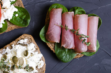 sandwiches with various fillings: ham, cheese, avocado, sauce