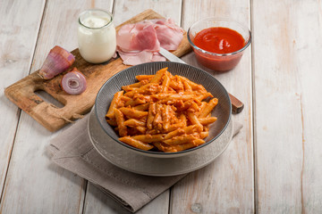 pasta with ham cream and tomato sauce