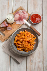 pasta with ham cream and tomato sauce