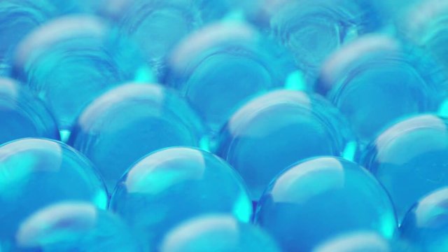 Close-up of blue hydrogel balls rotating