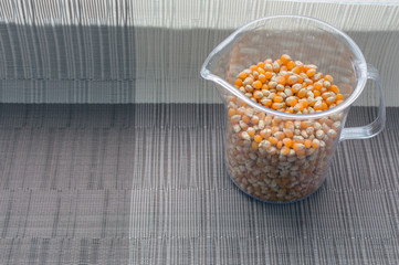 corn grains in the measuring bowl