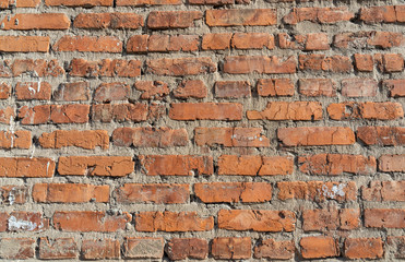 The texture of the old brickwork of red brick