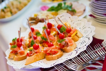 delicious snack dishes on buffet table at party banquet, catering service at open air summer party