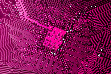 Close up photo of pink pcb printecd circuit board electric paths