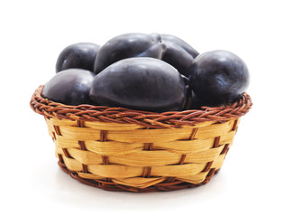 Group of plums in the basket.