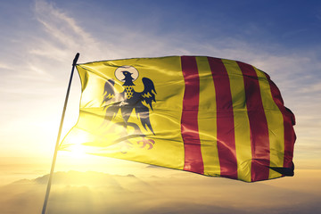 Morovis municipality of Puerto Rico flag waving on the top sunrise mist fog