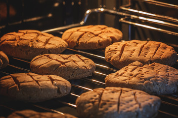 Brown rye circular flatbread in the oven